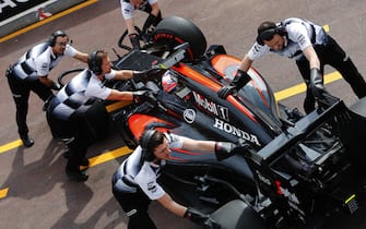 Monte Carlo, Monaco. 
Thursday 26 May 2016.
Jenson Button, McLaren MP4-31 Honda, is returned to the garage.
World Copyright: Steven Tee/LAT Photographic
ref: Digital Image _X0W5434