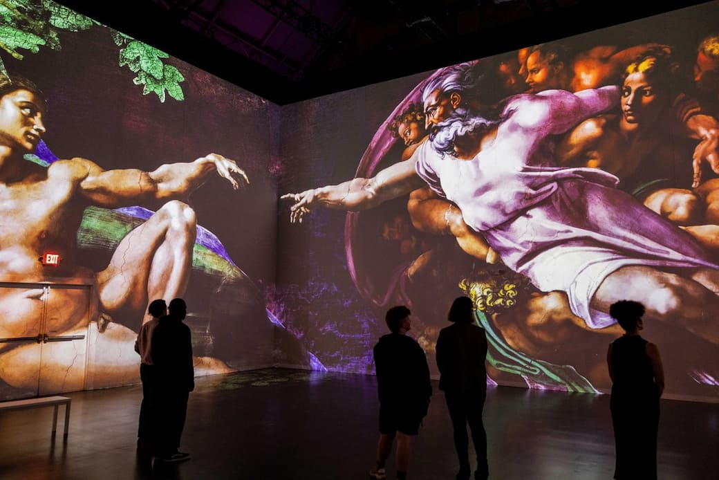 Viewers_take_in_“The_Creation_of_Adam”_by_Michelangelo_featured_in_“Immersive_Vatican.”_Photo_credit_Patrick_Hodgson.jpg