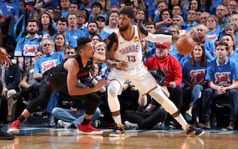 OKLAHOMA CITY, OK - APRIL 21: Paul George #13 of the Oklahoma City Thunder handles the ball against the Portland Trail Blazers during Game Four of Round One of the 2019 NBA Playoffs on April 21, 2019 at Chesapeake Energy Arena in Oklahoma City, Oklahoma. NOTE TO USER: User expressly acknowledges and agrees that, by downloading and/or using this photograph, user is consenting to the terms and conditions of the Getty Images License Agreement. Mandatory Copyright Notice: Copyright 2019 NBAE (Photo by Joe Murphy/NBAE via Getty Images)