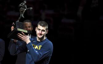 DENVER, CO - JUNE 11: Nikola Jokic (15) of the Denver Nuggets hoists his MVP trophy before the first quarter against the Phoenix Suns at Ball Arena on Friday, June 11, 2021. The Denver Nuggets hosted the Phoenix Suns for game three of their best-of-seven NBA Playoffs series. (Photo by AAron Ontiveroz/MediaNews Group/The Denver Post via Getty Images)