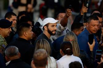 epa10412028 epa10411985 El Salvador's President Nayib Bukele attends an official event, in Mejicanos, El Salvador, 17 January 2023. Bukele stated on 17 January that El Salvador has become 'the safest country in Latin America' and pointed out that now young people 'are no longer victims' of violence.  EPA/Rodrigo Sura