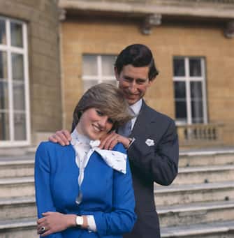24th February 1981:  Charles, Prince of Wales laughing with his fiancee Lady Diana Spencer (1961 - 1997) outside Buckingham Palace, London after announcing their engagement.  (Photo by Hulton Archive/Getty Images)
