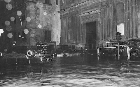 Cars floating in the flooded streets of Florence hit by the flood of the Arno River. Florence, November 1966 (Photo by Giorgio Lotti/Mondadori via Getty Images)