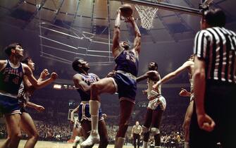 NEW YORK - 1970: Wilt Chamberlain #13 of the Philadelphia 76'ers goes for a dunk against the New York Knicks during the NBA game at Madison Square Garden in New York. NOTE TO USER: User expressly acknowledges  and agrees that, by downloading and or using this  photograph, User is consenting to the terms and conditions of the Getty Images License Agreement. (Photo by Walter Iooss Jr./ NBAE/ Getty Images)