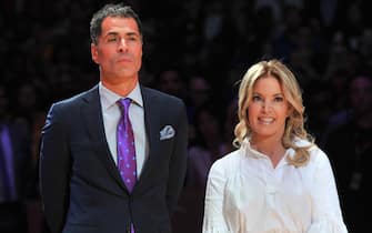 LOS ANGELES, CA - DECEMBER 18: Rob Pelinka and Jeanie Buss attend Kobe Bryant's jersey retirement ceremony during a basketball game between the Los Angeles Lakers and the Golden State Warriors at Staples Center on December 18, 2017 in Los Angeles, California.  (Photo by Allen Berezovsky/Getty Images)
