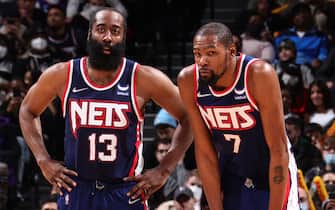 BROOKLYN, NY - JANUARY 1: James Harden #13 and Kevin Durant #7 of the Brooklyn Nets look on during the game against the LA Clippers on January 1, 2022 at Barclays Center in Brooklyn, New York. NOTE TO USER: User expressly acknowledges and agrees that, by downloading and or using this Photograph, user is consenting to the terms and conditions of the Getty Images License Agreement. Mandatory Copyright Notice: Copyright 2021 NBAE (Photo by Nathaniel S. Butler/NBAE via Getty Images)
