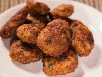 Close up of fried meatballs made from pork and beef meat on plate