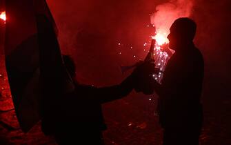 Fans of SSC Napoli celebrate on May 4, 2023 in Naples after Napoli won the Italian champions "Scudetto" title after a decisive match in Udine. - Napoli ended a 33-year wait to win Italy's Serie A on May 4 after a 1-1 draw at Udinese secured their third league title and emulated the great teams led by Diego Maradona. (Photo by Filippo MONTEFORTE / AFP) (Photo by FILIPPO MONTEFORTE/AFP via Getty Images)