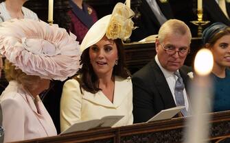 (L-R) Britain's Camilla, Duchess of Cornwall, Britain's Catherine, Duchess of Cambridge, Britain's Prince Andrew, Duke of York and Britain's Princess Beatrice of York wait in the chapel ahead of the wedding ceremony of Britain's Prince Harry, Duke of Sussex and US actress Meghan Markle in St George's Chapel, Windsor Castle, in Windsor, on May 19, 2018. (Photo by Jonathan Brady / POOL / AFP) (Photo by JONATHAN BRADY/POOL/AFP via Getty Images)