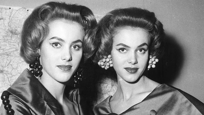25th January 1956:  Twin dancers Alice and Ellen Kessler wearing a new hair style called 'Physalis' created by Carita and Alexandra in Paris.  (Photo by Keystone/Getty Images)