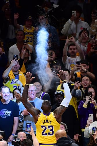 LOS ANGELES, CA - APRIL 25: LeBron James #23 of the Los Angeles Lakers throws chalk before the game against the Denver Nuggets during Round One Game Three of the 2024 NBA Playoffs on April 25, 2024 at Crypto.Com Arena in Los Angeles, California. NOTE TO USER: User expressly acknowledges and agrees that, by downloading and/or using this Photograph, user is consenting to the terms and conditions of the Getty Images License Agreement. Mandatory Copyright Notice: Copyright 2024 NBAE (Photo by Adam Pantozzi/NBAE via Getty Images)