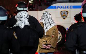 epa11311443 New York City police officers make an arrest after entering Hamilton Hall at Columbia University after protesters barricaded themselves in the building earlier in the day in New York, New York, USA, 30 April 2024. Students have been protesting the university's investments in Israel and showing their support for Palestine for over two weeks, also inspiring other students nationwide to do the same.  EPA/STEPHANI SPINDEL