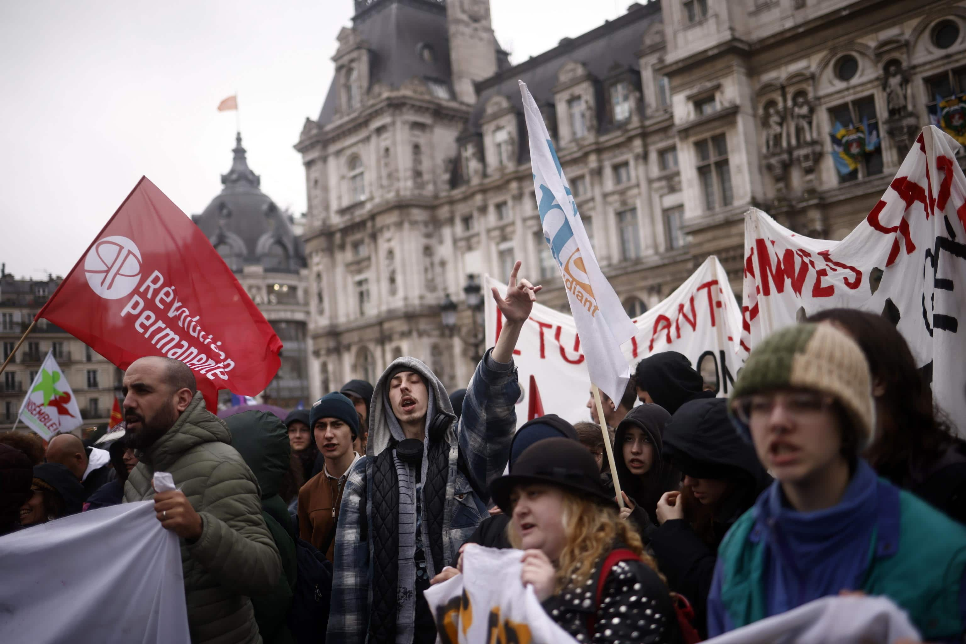 epa10572684 People protest outside the Paris town hall after the proclamation of the French Constitutional Council's decision about the pension reform text in Paris, France, 14 April 2023. The 'sages', members of the Constitutional Council, have approved, on 14 April, the text of the pension reform presented by President Macron's government, while rejecting some of its measures as well as the request of a referendum about it. The new reform key change has been the raise of retirement age from 62 to 64.  EPA/YOAN VALAT