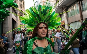 MADRID, SPAIN - 2024/03/16: A person dressed with fancy clothes during the celebration of Saint Patrick's Day parade. More than 500 bagpipers have walked the streets of the center of Madrid to celebrate Saint Patrick's Day. (Photo by Marcos del Mazo/LightRocket via Getty Images)