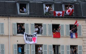 PARIS, FRANCE - JULY 26: Spectators applaud athletes during the opening ceremony of the Paris 2024 Olympic Games on July 26, 2024 in Paris, France. (Photo by Thomas Smson - Pool/Getty Images)