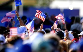 USA and European flags are waved ahead of the Ryder Cup Opening Ceremony at the Marco Simone Golf and Country Club, Rome, Italy. Picture date: Thursday September 28, 2023.