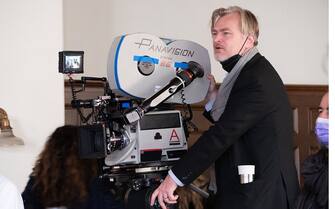 Writer, director, and producer Christopher Nolan on the set of OPPENHEIMER.