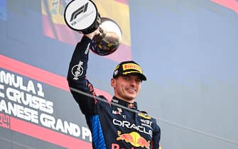SUZUKA, JAPAN - APRIL 07: Max Verstappen, Red Bull Racing, 1st position, lifts the trophy in celebration during the Japanese GP at Suzuka on Sunday April 07, 2024 in Suzuka, Japan. (Photo by Simon Galloway / LAT Images)