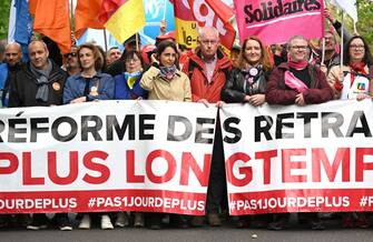 Outgoing French Democratic Confederation of Labour (CFDT) union's general secretary Laurent Berger (L), soon-to-be acting CFDT leader leader Marylise Leon (2L), French CGT trade union General Secretary Sophie Binet (C), French Solidaires trade union co general delegate Murielle Guilbert (CR), French Solidaires trade union co general delegate Simon Dutei (2R) take part in a demonstration on May Day (Labour Day), to mark the international day of the workers, more than a month after the government pushed an unpopular pensions reform act through parliament, in Paris, on May 1, 2023. - Opposition parties and trade unions have urged protesters to maintain their three-month campaign against the law that will hike the retirement age to 64 from 62. (Photo by Alain JOCARD / AFP) (Photo by ALAIN JOCARD/AFP via Getty Images)