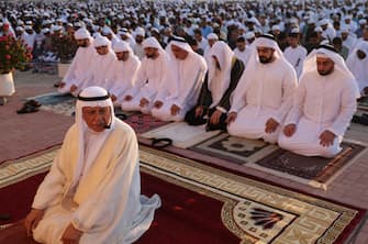 epa10583296 Emirati cleric Aref Sheikh (L) leads the Eid al-Adha prayer at Nad Al Hammar Eid musalla in the Gulf of emirate of Dubai, United Arab Emirates, 21 April 2023. Muslims around the world celebrate Eid al-Fitr, the three day festival marking the end of the Muslim holy month of Ramadan, which is starting on 21 April and some other countries on 22th May depending on the lunar calendar. Eid al-Fitr is one of the two major holidays in Islam.  EPA/ALI HAIDER
