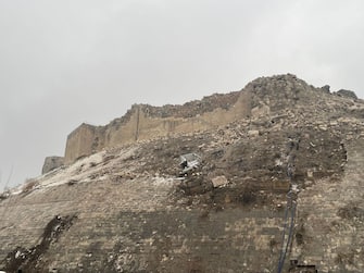 GAZIANTEP, TURKIYE - FEBRUARY 06: A view of damaged historical Gaziantep Castle after a 7.4 magnitude earthquake hit southern provinces of Turkiye, in Gaziantep, Turkiye on February 6, 2023. The 7.4 magnitude earthquake jolted Turkiye's southern province of Kahramanmaras early Monday, according to Turkiye's Disaster and Emergency Management Authority (AFAD). It was followed by a magnitude 6.4 quake that struck southeastern Gaziantep province. A third earthquake with a 6.5 magnitude also hit Gaziantep. Earthquakes had affected several provinces including, Osmaniye, Malatya, AdÃ Â±yaman, Adana, DiyarbakÃ Â±r, Kilis and Sanliurfa. (Photo by Mehmet Akif Parlak/Anadolu Agency via Getty Images)