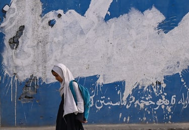 An Afghan primary school girl walks along a road in Khost on April 22, 2024. (Photo by Wakil Kohsar / AFP) (Photo by WAKIL KOHSAR/AFP via Getty Images)