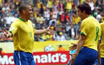 epa02583226 (FILE) A file picture dated 27 June 2006 shows Brazlian striker Ronaldo (L) celebrating with his team mate Kaka (R) after scoring the opening goal during the 2nd round soccer match of the 2006 FIFA World Cup between Brazil and Ghana in Dortmund, Germany. Three-time world footballer of the year Ronaldo announced on 14 February 2011 he was quitting the game. The 34-year-old Brazilian striker for Sao Paulo's Corinthians confirmed his retirement at a news conference. In an 18-year-career, Ronaldo won two World Cups in which he broke the record for most goals scored in the tournament. Ronaldo played 97 caps for Brazil, scoring 62 goals. His club career included spells in Europe at PSV Eindhoven, Barcelona, Inter Milan, Real Madrid and AC Milan before he returned in 2009 to Brazil to play for Corinthians.  EPA/ACHIM SCHEIDEMANN