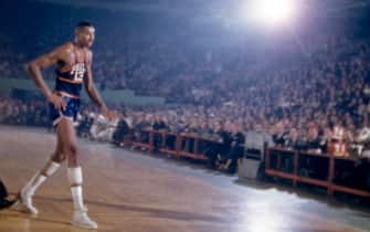 BOSTON, MA - NOVEMBER 25:  Wilt Chamberlain #13 of the Philadelphia Warriors walks off the court as Tom Heinsohn #15 of the Boston Celtics wipes his brow during an NBA game on November 25, 1959 at the Boston Garden in Boston, Massachusetts.  (Photo by Hy Peskin/Getty Images) (Set Number: X6393)