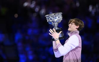 epa11110471 Jannik Sinner of Italy lifts the Norman Brookes Challenge Cup following his Menâ  s Singles final win against Daniil Medvedev of Russia on Day 15 of the Australian Open tennis tournament in Melbourne, Australia, 28 January 2024.  EPA/JOEL CARRETT AUSTRALIA AND NEW ZEALAND OUT