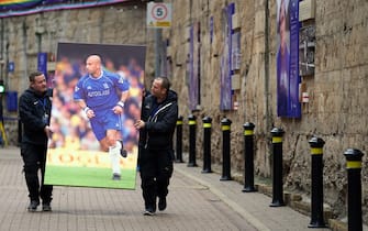 Staff move a giant photo of Gianluca Vialli at Chelsea's Stamford Bridge ground, London, following the announcement of the death of the former Italy, Juventus and Chelsea striker who has died aged 58 following a lengthy battle with pancreatic cancer. Picture date: Friday January 6, 2023.