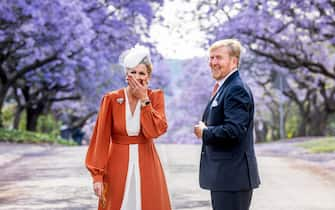 PRETORIA, SOUTH AFRICA - OCTOBER 18: King Willem-Alexander of The Netherlands and Queen Maxima of The Netherlands pose at the Jacaranda Trees  on October 18, 2023 in Pretoria, South Africa. (Photo by Patrick van Katwijk/Getty Images) *** Local Caption *** King Willem-Alexander ; Queen Máxima