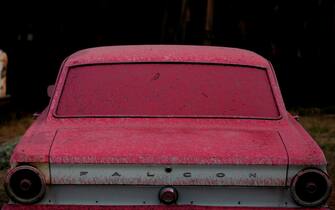 Los Angeles SANTA CLARITA, CA - JULY 24, 2016: Several buildings and cars including this Falcon, were drenched in Phos-Chek, a pink fire retardant, at the Sable Ranch was burned in the Sand Fire, off of Sand Canyon Rd, in Santa Clarita, CA July 24, 2016. The ranch is used varies movie and TV productions. Several of the sets were destroyed in the fire. (Francine Orr/ Los Angeles Times)