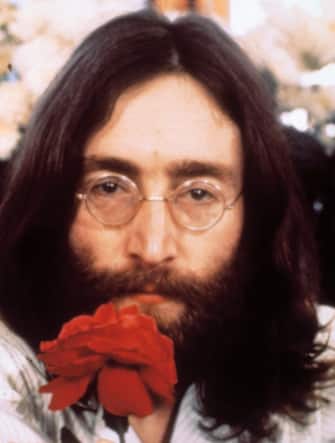 (Original Caption) Head shot of Beatle John Lennon with rose during the "Bed-in for Peace" demonstration. (Photo by Bettmann via Getty Images)