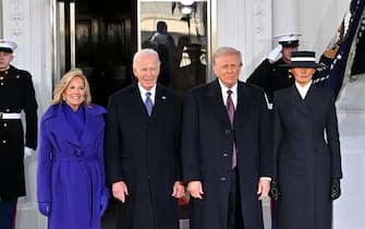 US President Joe Biden and First Lady Jill Biden pose alongside President-elect Donald Trump and Melania Trump as they arrive at the White House in Washington, DC, on January 20, 2025, before departing for the US Capitol where Trump will be sworn in as the 47th US President. (Photo by ROBERTO SCHMIDT / AFP)