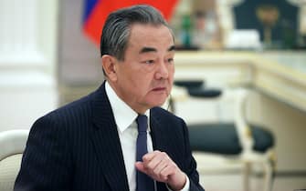 epa10483422 China's Director of the Office of the Central Foreign Affairs Commission Wang Yi listens to Russian President Putin during their meeting in the Kremlin, in Moscow, Russia, 22 February 2023.  EPA/ANTON NOVODEREZHKIN/SPUTNIK/KREMLIN / POOL MANDATORY CREDIT