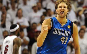 Dirk Nowitzki of the Dallas Mavericks celebrates a point against the Miami Heat in Game 6 of  the NBA Finals on June 12, 2011 at the AmericanAirlines Arena in Miami, Florida.  Jason Terry scored 27 points and Nowitzki finished with 21 points and 11 rebounds as the Mavericks won 105-95 to take the best-of-seven championship series four-games-to-two to claim their first NBA championship in franchise history. AFP PHOTO / Don EMMERT (Photo credit should read DON EMMERT/AFP via Getty Images)