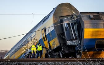 Voorschoten - Emergency services at work at a derailed night train. The passenger train collided with construction equipment on the track. One person died and several people were seriously injured. A freight train was also involved in the accident. ANP REMKO DE WAAL netherlands out - belgium out(Photo by Remko de Waal/ANP/Sipa USA)