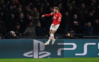 EINDHOVEN, NETHERLANDS - DECEMBER 12:   Yorbe Vertessen of PSV Eindhoven celebrates scoring a goal to make the score 1-1 during the UEFA Champions League Group B match between PSV Eindhoven and Arsenal FC at Philips Stadion on December 12, 2023 in Eindhoven, Netherlands. (Photo by Fantasista/Getty Images)