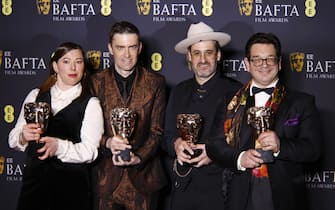 epa11901719 (L-R) Lizzie Gillett, Robert Ford, Ian Bonhote and Peter Ettedgui pose in the press room after winning the Best Documentary award for 'Super/Man: The Christopher Reeve Story' during the BAFTA Film Awards at the Royal Festival Hall in London, Britain, 16 February 2025. The ceremony is hosted by the British Academy of Film and Television Arts (BAFTA).  EPA/TOLGA AKMEN