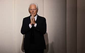 Italian fashion designer Giorgio Armani acknowledges the audience at the end of the Giorgio Armani Prive show as part of the Women's Haute-Couture Fall/Winter 2023/2024 Fashion Week in Paris on July 4, 2023. (Photo by Bertrand GUAY / AFP)