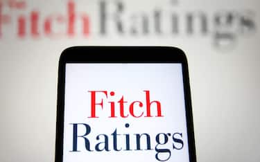 UKRAINE - 2021/09/12: In this photo illustration, Fitch Ratings Inc. logo is seen on a smartphone and a pc screen. (Photo Illustration by Pavlo Gonchar/SOPA Images/LightRocket via Getty Images)
