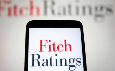 UKRAINE - 2021/09/12: In this photo illustration, Fitch Ratings Inc. logo is seen on a smartphone and a pc screen. (Photo Illustration by Pavlo Gonchar/SOPA Images/LightRocket via Getty Images)