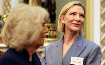 LONDON, ENGLAND - FEBRUARY 18: Actor Cate Blanchett reacts as Queen Camilla walks past, on the day she attends a reception for staff, actors and supporters of the National Theatre at Buckingham Palace on February 18, 2025 in London, England. (Photo by Isabel Infantes - WPA Pool/Getty Images)