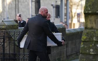 The father of Indi Gregory, Dean Gregory (front) carries the casket of his daughter in to St Barnabus Cathedral, Nottingham, for her funeral service. The baby girl died shortly after her life-support treatment was withdrawn after her parents, Mr Gregory and Claire Staniforth who are both in their 30s and from Ilkeston, Derbyshire, lost legal bids in the High Court and Court of Appeal in London for specialists to keep treating her. Picture date: Friday December 1, 2023.