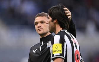 NEWCASTLE UPON TYNE, ENGLAND - OCTOBER 21: Sandro Tonali of Newcastle is embraced by captain Kieran Trippier after the Premier League match between Newcastle United and Crystal Palace at St. James Park on October 21, 2023 in Newcastle upon Tyne, England. (Photo by Stu Forster/Getty Images)