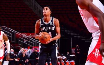 HOUSTON, TX - DECEMBER 15:   Devin Vassell #24 of the San Antonio Spurs shoots a free throw on December 15, 2020 at the Toyota Center in Houston, Texas. NOTE TO USER: User expressly acknowledges and agrees that, by downloading and or using this photograph, User is consenting to the terms and conditions of the Getty Images License Agreement. Mandatory Copyright Notice: Copyright 2020 NBAE (Photo by Cato Cataldo/NBAE via Getty Images)