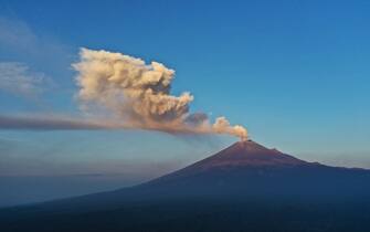 TOPSHOT - The Popocatepetl Volcano spews ash and smoke as seen from Puebal, state of Puebla, Mexico, on May 18, 2023. The Popocatepetl volcano, located about 55 km from Mexico City, has recorded numerous low-intensity exhalations in the past few days. (Photo by JOSE CASTAÃ ARES / AFP) (Photo by JOSE CASTANARES/AFP via Getty Images)