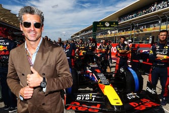 AUSTIN, TEXAS - OCTOBER 22: Patrick Dempsey poses for a photo on the grid prior to the F1 Grand Prix of United States at Circuit of The Americas on October 22, 2023 in Austin, Texas. (Photo by Mark Thompson/Getty Images)