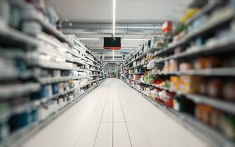 Florence, Italy - December 27, 2021: Supermarket aisle with merchandise and no people in Italy