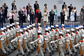 Pioneers of the French Legion Etrangere march past officials including France's President Emmanuel Macron (C) during the Bastille Day military parade along the Avenue Foch in Paris on July 14, 2024. (Photo by JULIEN DE ROSA / AFP) (Photo by JULIEN DE ROSA/AFP via Getty Images)